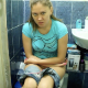A girl records herself shitting while sitting on a toilet in her own bathroom. There are 4 scenes. In two scenes, she records herself from behind looking down, so we can see the poop coming out. Poop sounds are also nicely audible. Over 10 minutes.